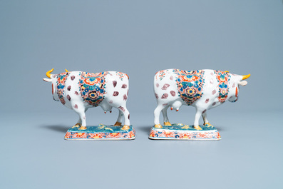 A pair of of polychrome Dutch Delft models of cows, 18th C.