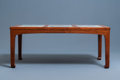 A Chinese wooden table with three qianjiang cai plaques, 19/20th C.