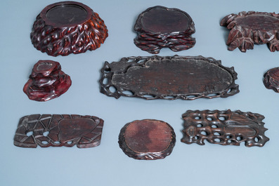 Nine Chinese naturalistically carved wooden stands, 19/20th C.