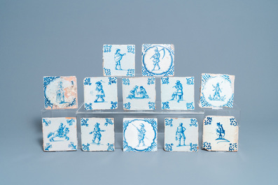 Twelve Dutch Delft blue and white tiles with figures, 17th C.