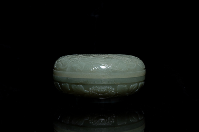 A Chinese pale celadon jade 'phoenix and peony' circular box and cover, 19th C.