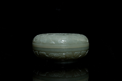 A Chinese pale celadon jade 'phoenix and peony' circular box and cover, 19th C.