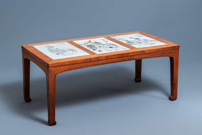 A Chinese wooden table with three qianjiang cai plaques, 19/20th C.