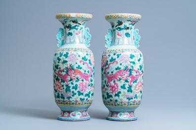 A pair of Chinese famille rose celadon-ground 'dragon' vases, 19th C.
