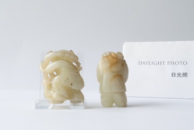 Two Chinese celadon jade figures of boys, 19/20th C.