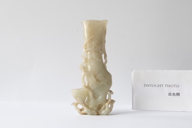 A Chinese jade vase on reticulated stand, Qing