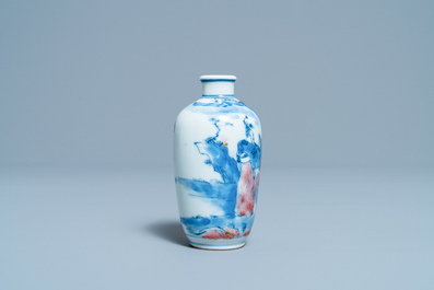 A small Chinese blue, white and copper-red vase, 19th C.