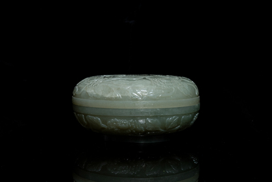 A Chinese pale celadon jade 'phoenix and peony' circular box and cover, 19th C.