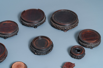 Ten Chinese reticulated carved wooden stands, 19/20th C.