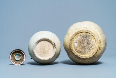 A Chinese celadon-glazed 'Jue' ewer, a qingbai-glazed wine ewer and a storage vessel, Song/Yuan