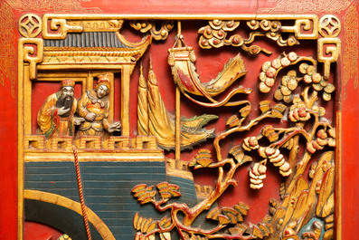 A Chinese lacquered and polychromed carved wooden panel, 19th C.