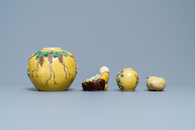 Two Chinese yellow and verte biscuit jars, a Buddha figure and a peach-shaped brush washer, 19/20th C.