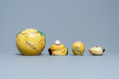 Two Chinese yellow and verte biscuit jars, a Buddha figure and a peach-shaped brush washer, 19/20th C.
