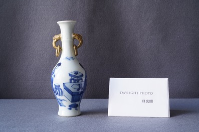 A Chinese blue and white vase with gilt elephant-head handles, Kangxi