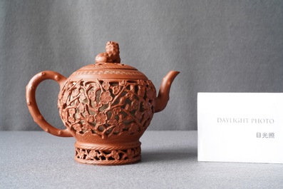 A Chinese reticulated Yixing stoneware teapot and cover, Kangxi