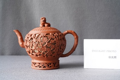 A Chinese reticulated Yixing stoneware teapot and cover, Kangxi