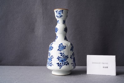 A Chinese blue and white elongated huqqa base with floral design, Kangxi