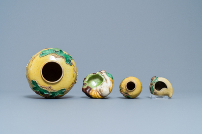 Two Chinese yellow and verte biscuit jars, a Buddha figure and a peach-shaped brush washer, 19/20th C.