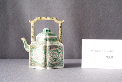 A Chinese verte biscuit teapot and cover, Kangxi