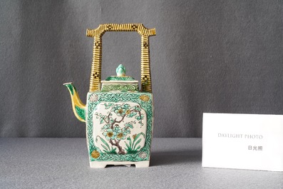 A Chinese verte biscuit teapot and cover, Kangxi