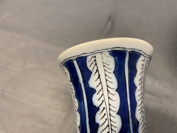 A pair of unusual polychrome Dutch Delft chinoiserie vases with a dragon and birds in a flowery garden, 17th C.