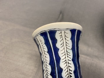 A pair of unusual polychrome Dutch Delft chinoiserie vases with a dragon and birds in a flowery garden, 17th C.