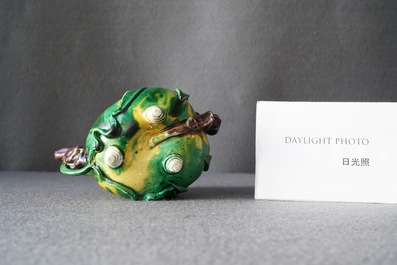 A Chinese verte biscuit peach-shaped 'cadogan' teapot, Kangxi