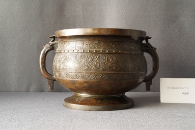 A large Chinese bronze 'Gui' vessel on hardwood stand, Yuan