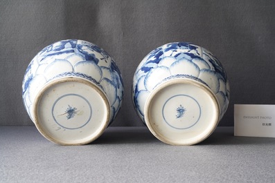 A pair of Chinese blue and white 'hunting scene' jars and covers, Kangxi