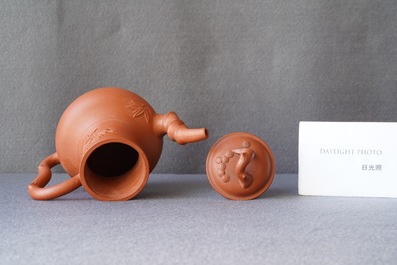 A pair of Chinese Yixing stoneware teapots and covers, Kangxi