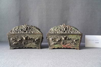 A pair of Chinese Ming-style bronze censers with reticulated covers, 19th C.