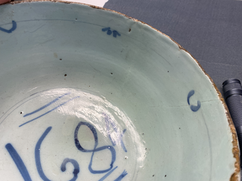 A blue and white English Delftware bowl dated 1684