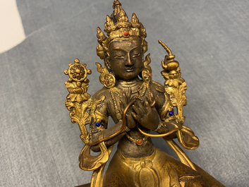 A Chinese gilt bronze figure of Buddha, 18/19th C.