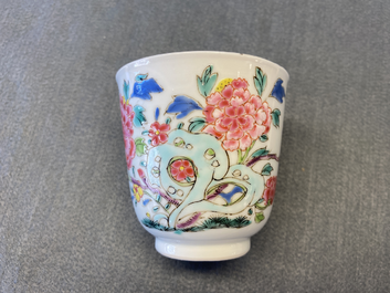 A Chinese famille rose cup and saucer with a bird on a blossoming branch, Yongzheng