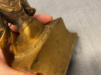 A Chinese gilt bronze figure of Buddha, 18/19th C.