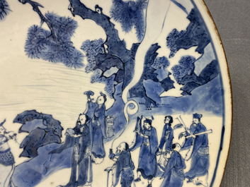 Un plat en porcelaine de Chine en bleu et blanc &agrave; d&eacute;cor d'immortels, marque Yu Tang Jia Qi, Shunzhi