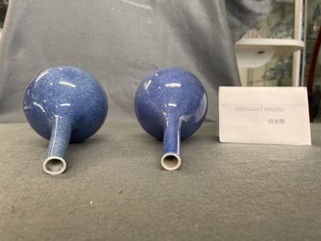 A pair of Chinese monochrome powder blue bottle vases, Kangxi