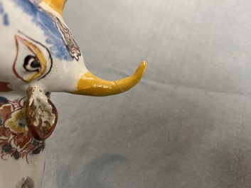A pair of of polychrome Dutch Delft models of cows, 18th C.