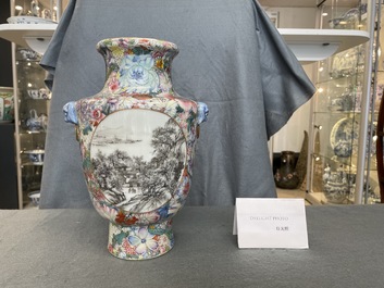 Un vase en porcelaine de Chine famille rose &agrave; d&eacute;cor de paysages en grisaille sur un fond de millefleurs, marque de Qianlong, R&eacute;publique