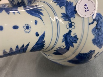 A Chinese blue and white bottle vase with figures in a landscape, Transitional period