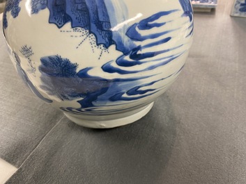 A Chinese blue and white bottle vase with figures in a landscape, Transitional period