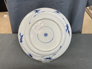 A Chinese blue, white and copper red powder blue-ground dish, Kangxi