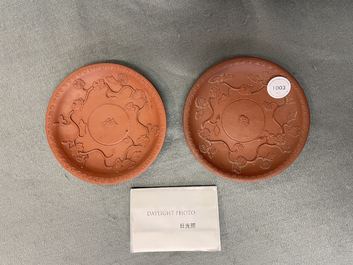 A pair of Chinese Yixing stoneware dishes with applied design, Kangxi