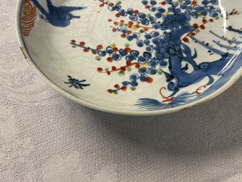 Three Chinese blue, white, copper red and wucai ko-sometsuke plates for the Japanese market, Tianqi/Chongzhen