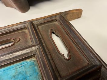 A Chinese square fahua 'Immortals' plaque mounted in a wooden table screen, Ming