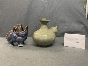 A Chinese celadon-glazed kendi and a Shiwan flamb&eacute;-glazed beast-shaped censer, 18/19th C.