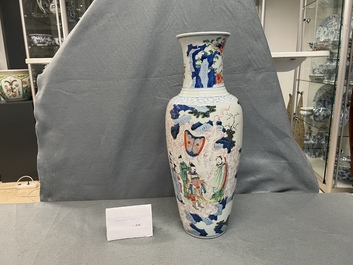 A Chinese wucai vase with continuous figurative design, 19th C.