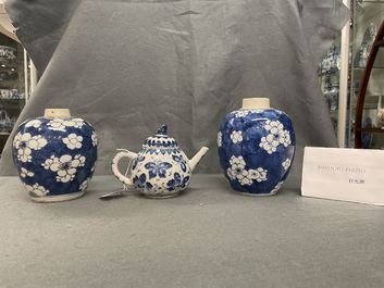 A pair of Chinese blue and white 'prunus on cracked ice' jars and a 'butterfly' teapot and cover, Kangxi