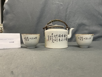 A Chinese qianjiang cai teapot and two cups and saucers, 19/20th C.