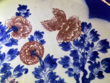 A Chinese blue, white and copper red powder blue-ground charger, Kangxi